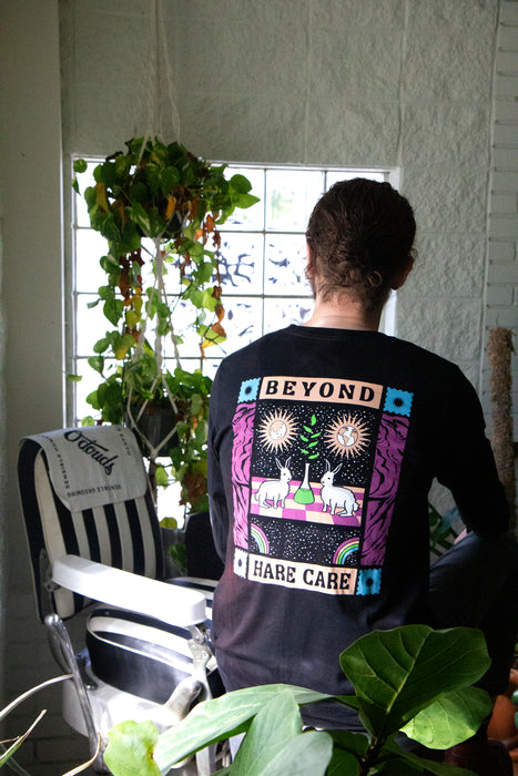 Black longsleeve featuring "Beyond Hare Care" illustration sitting near barber chair
