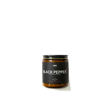 Black Pepper candle black label amber glass container on white background